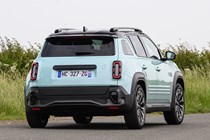 Renault 4 E-Tech review, moving, blue, rear three quarters | Parkers