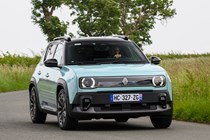 Renault 4 E-Tech review, blue, moving, front three quarters | Parkers