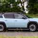 Renault 4 E-Tech review, moving, blue, side | Parkers