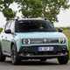 Renault 4 E-Tech review, blue, moving, front three quarters | Parkers