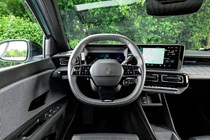 Renault 4 E-Tech review, interior, grey and black steering wheel | Parkers