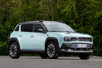 Renault 4 E-Tech review, blue, static, front three quarters | Parkers