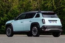 Renault 4 E-Tech review, blue, static, rear three quarters | Parkers