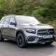 Mercedes GLB (2023) review: front three quarter driving, silver paint, British B-road