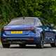 Audi A6 saloon (2025) review: rear three quarter cornering, blue paint, low angle