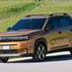 Fiat Grande Panda Hybrid (2025) review: front three quarter driving, bronze paint