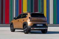 Fiat Grande Panda Hybrid (2025) review: rear three quarter static, bronze paint
