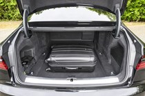 Image of the Audi S8's open boot, with a suitcase loaded in