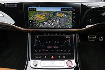 Image of the Audi S8's dashboard, showing the infotainment and climate control screens