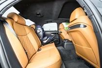 Image of the Audi S8's rear seats, viewed from the open right-hand door, with a child seat on the left-hand side