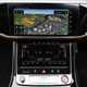 Image of the Audi S8's dashboard, showing the infotainment and climate control screens