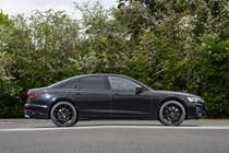 Image of a static, black Audi S8, looking at its right side