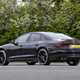 Image of a static, black Audi S8, looking at its rear left corner