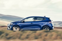 Renault Clio (2023) review: pan shot driving, country lane, blue paint