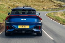 Kia EV6 GT review - facelift, rear, blue, driving round corner