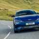 Kia EV6 GT review - facelift, front, blue, driving round corner