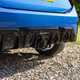 Close-up view of a blue MINI JCW's rear diffuser and exhaust outlet