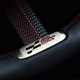 Close-up image of a MINI JCW's John Cooper Works steering wheel badge