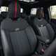 Image of a MINI JCW's front seats, viewed from the front towards the back of the car