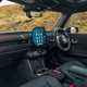 Image of the MINI JCW's front interior, looking across from the open passenger door