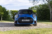 Image of a blue MINI JCW, viewed from head-on