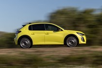 Peugeot E-208 review - facelift, side view, driving, yellow