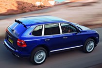 Porsche Cayenne, rear three quarters, blue, driving | Parkers