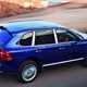 Porsche Cayenne, rear three quarters, blue, driving | Parkers