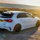 Mercedes-AMG A45 S review - facelift, rear, white, driving round corner