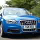 The Audi S6 V10, blue, front three-quarters, driving