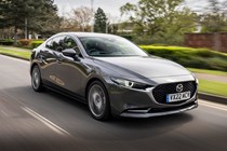 Mazda 3 Saloon review, front, grey, driving
