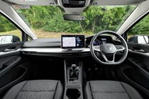 Volkswagen Golf (2024) review: dashboard and infotainment system, black and grey fabric upholstery