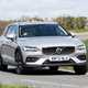 Volvo V60 Cross Country (2023) review: front three quarter cornering, silver paint, rural background, sunny weather