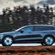 Grey 2019 Volvo V60 Cross Country side elevation driving