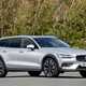 Volvo V60 Cross Country (2023) review: front three quarter static, silver paint, wooded background