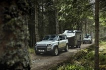 Land Rover Defender 110 (2020-) driving action - trekking through the forest