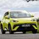 BYD Dolphin Surf (2025) review: front three quarter cornering, yellow paint, low angle