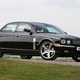 Jaguar XJR, black, static, exterior, front three quarters | Parkers
