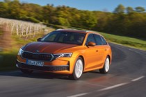 Skoda Octavia Estate review, Mk4 facelift, orange, front, driving round corner