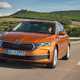 Skoda Octavia Estate review, Mk4 facelift, orange, front, driving on motorway