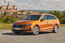 Skoda Octavia Estate review, Mk4 facelift, orange, front, Czech castle in the background