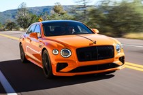 Bentley Flying Spur review - V8 plug-in hybrid, Mandarin orange, front, driving