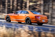 Bentley Flying Spur review - V8 plug-in hybrid, Mandarin orange, rear, driving