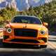 Bentley Flying Spur review - V8 plug-in hybrid, Mandarin orange, dead-on front, driving