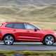 Volvo XC60 T8 Recharge, red, side view, driving