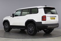 Image of a white Toyota Land Cruiser Commercial, viewed from the rear left three-quarters