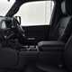 Image of the Toyota Land Cruiser Commercial's front seats and dashboard, viewed through the open front passenger door
