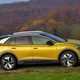 Yellow 2021 Volkswagen ID.4 side elevation driving