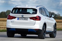 BMW iX3 (2021) rear view, driving