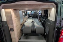Image of the Citroen Holidays interior with the bed folded out, seen through the open tailgate